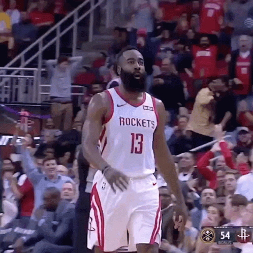 A Basketball Player Wearing A Jersey That Says Rockets Is Standing In Front Of A Crowd . GIF