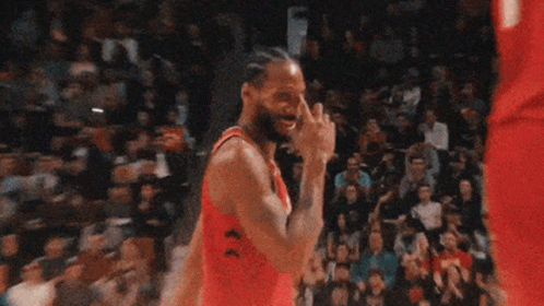 a basketball player wearing a jersey that says rose talks to another player