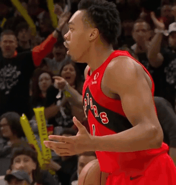 a basketball player wearing a jersey that says toronto raptors