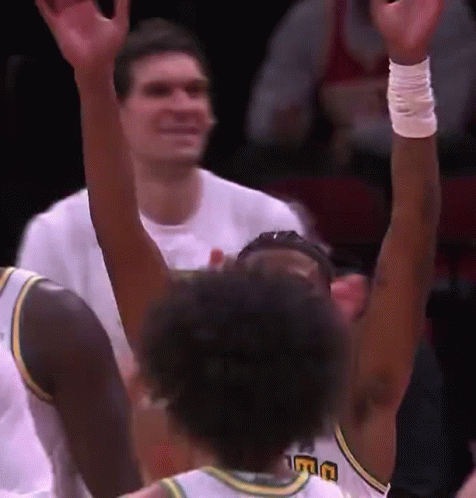 A Basketball Player Wearing A Jersey That Says Uc On It GIF