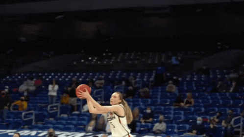 A Basketball Player Wearing A Jersey That Says Uconn On It GIF