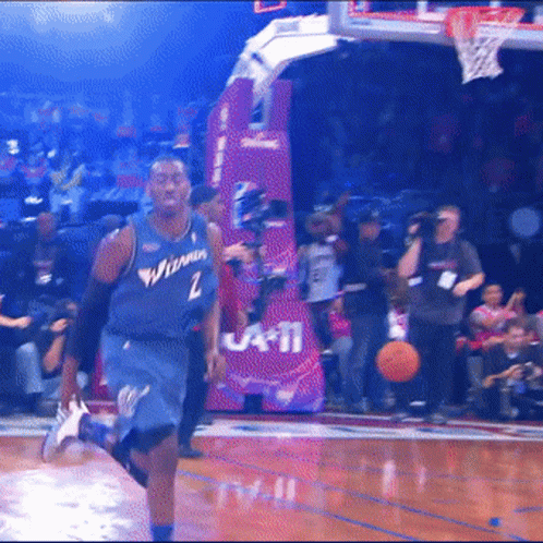 A Basketball Player Wearing A Jersey That Says Washington GIF