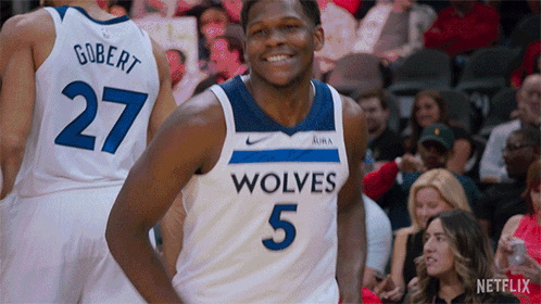 A Basketball Player Wearing A Jersey That Says Wolves GIF