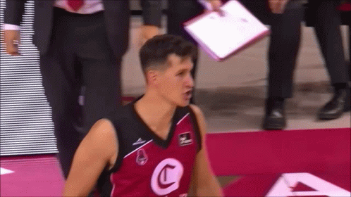 A Basketball Player Wearing A Jersey With A Letter C On It GIF
