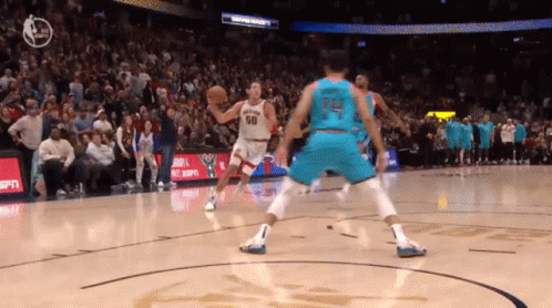 A Basketball Player Wearing A Jersey With The Number 14 On It GIF