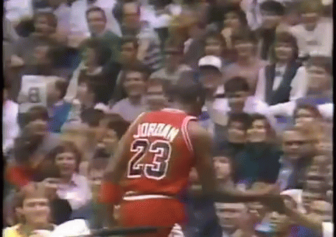 A Basketball Player Wearing A Jersey With The Number 23 On It GIF