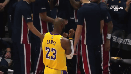 A Basketball Player Wearing A Jersey With The Number 23 On It GIF