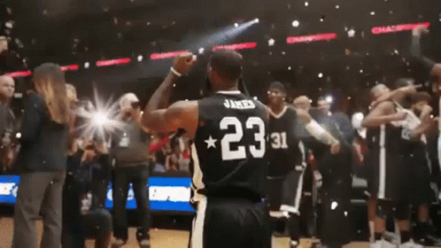 A Basketball Player Wearing A Jersey With The Number 23 On The Back GIF