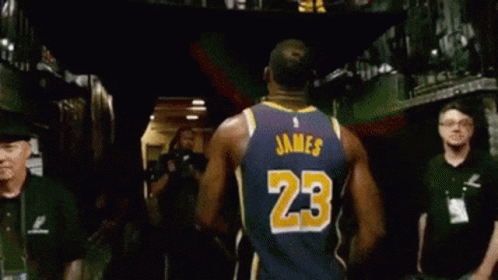 A Basketball Player Wearing A Jersey With The Number 23 On The Back GIF