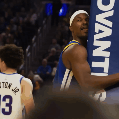A Basketball Player Wearing A Jersey With The Number 3 GIF