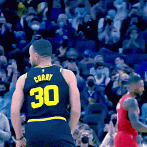 A Basketball Player Wearing A Jersey With The Number 30 On It GIF