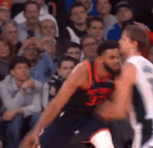 A Basketball Player Wearing A Jersey With The Number 33 GIF