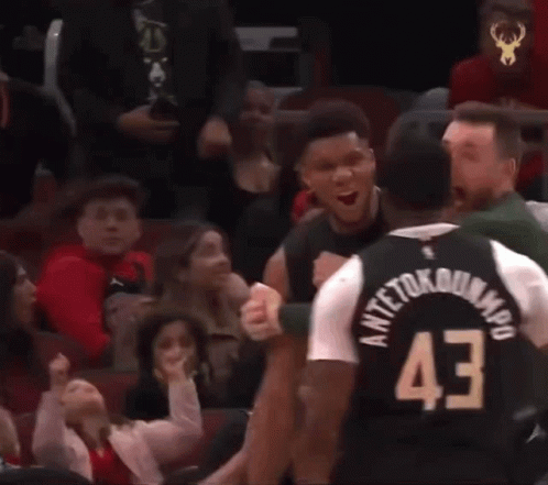 A Basketball Player Wearing A Jersey With The Number 43 On It Is Talking To Another Player . GIF