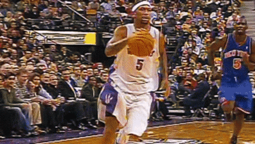 A Basketball Player Wearing A Jersey With The Number 5 On It GIF