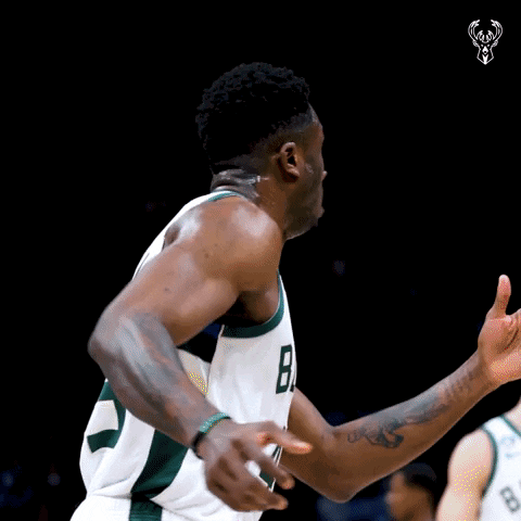 A Basketball Player Wearing A Jersey With The Number 8 On It GIF