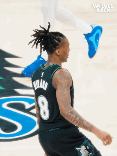 a basketball player wearing a jersey with the number 8