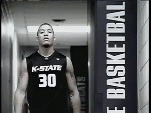 a basketball player wearing a k-state jersey number 30