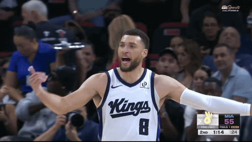 A Basketball Player Wearing A Kings Jersey Celebrates During A Game GIF