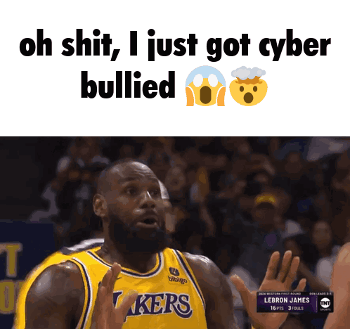 a basketball player wearing a lakers jersey is being bullied