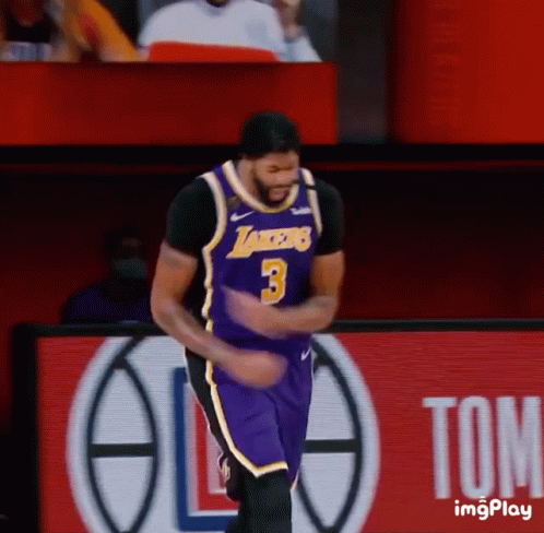 A Basketball Player Wearing A Lakers Jersey Is Dancing On The Court GIF