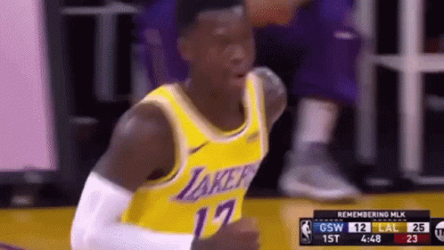 A Basketball Player Wearing A Lakers Jersey Is Giving A Thumbs Up During A Game GIF