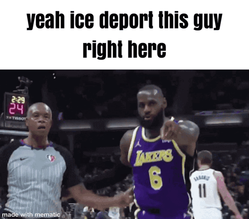 A Basketball Player Wearing A Lakers Jersey Is Pointing At A Referee GIF