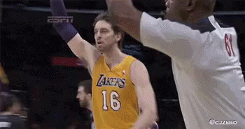 A Basketball Player Wearing A Lakers Jersey Is Reaching For The Ball GIF