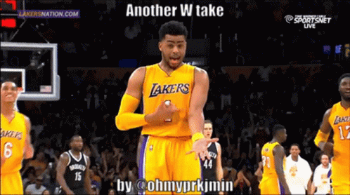 A Basketball Player Wearing A Lakers Jersey Is Standing In Front Of A Crowd GIF