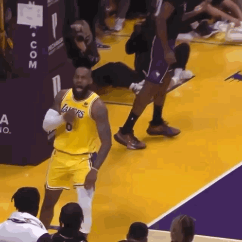 A Basketball Player Wearing A Lakers Jersey Stands On A Court GIF