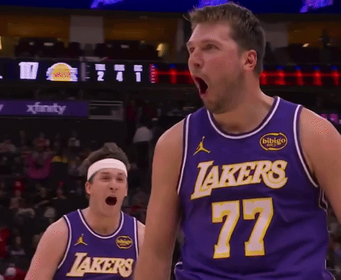 A Basketball Player Wearing A Lakers Jersey Stands With His Mouth Open GIF