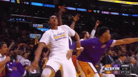 A Basketball Player Wearing A Los Angeles T-Shirt Is Jumping In The Air GIF