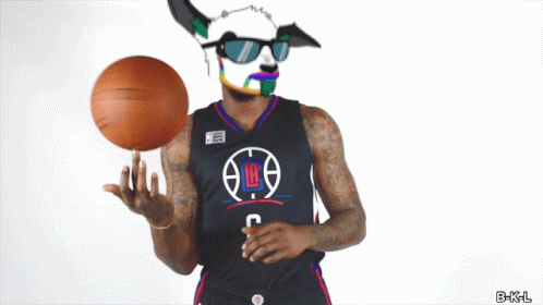 a basketball player wearing a mask and sunglasses holds a basketball
