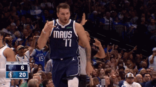 A Basketball Player Wearing A Maus 77 Jersey Is Giving A Thumbs Up GIF
