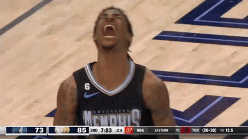 A Basketball Player Wearing A Memphis Jersey Is Screaming GIF