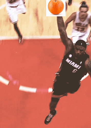 a basketball player wearing a miami 6 jersey jumps in the air