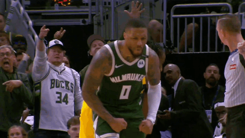a basketball player wearing a milwaukee jersey