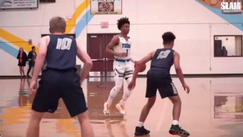 A Basketball Player Wearing A Number 10 Jersey Dribbles The Ball GIF