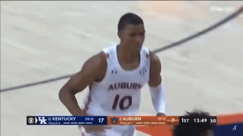 A Basketball Player Wearing A Number 10 Jersey Is Running On The Court GIF