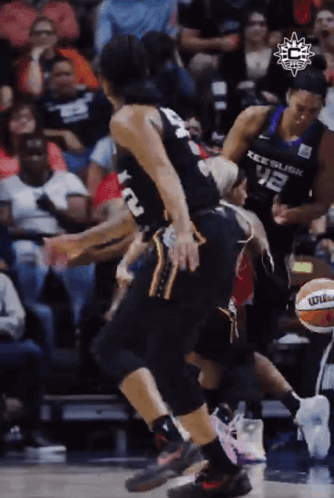 A Basketball Player Wearing A Number 12 Jersey GIF