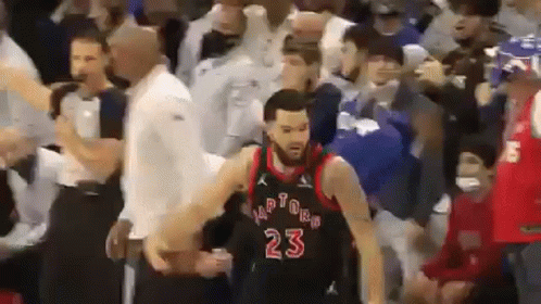 A Basketball Player Wearing A Number 23 Jersey Is Surrounded By Fans . GIF