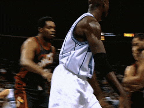 A Basketball Player Wearing A Number 4 Jersey GIF
