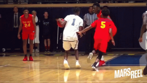 A Basketball Player Wearing A Number 5 Jersey Dribbles The Ball GIF