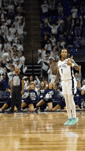 A Basketball Player Wearing A Penn State Jersey Celebrates On The Court GIF