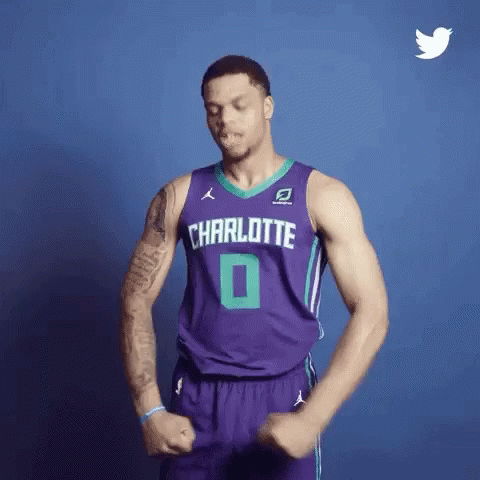 A Basketball Player Wearing A Purple Jersey With Charlotte On It GIF
