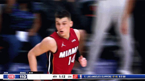 A Basketball Player Wearing A Red Jersey That Says Miami 14 GIF