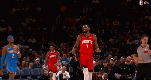 A Basketball Player Wearing A Red Jersey That Says Rockets On It GIF
