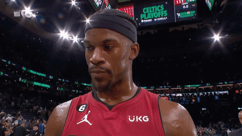A Basketball Player Wearing A Red Jersey That Says Ukg On It GIF