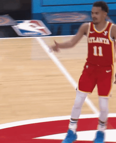A Basketball Player Wearing A Red Jersey With The Number 11 GIF