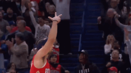 A Basketball Player Wearing A Red Jersey With The Number 15 On It GIF