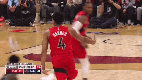a basketball player wearing a red jersey with the number 4 on it